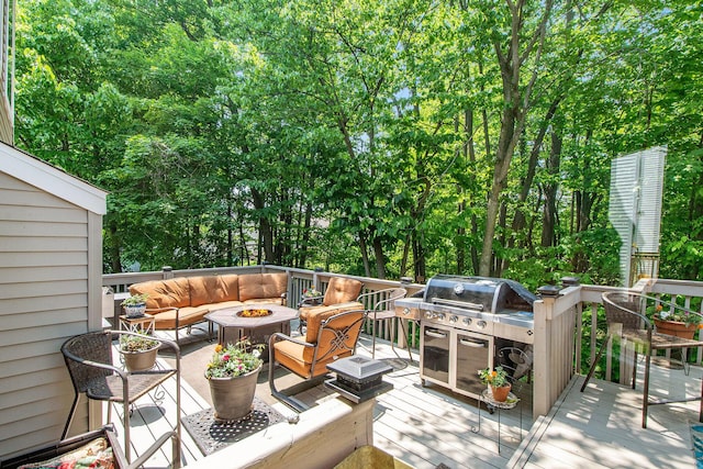 5591 E Grove Dr SE, Grand Rapids, MI 49512 - wooden terrace with an outdoor living space with a fire pit