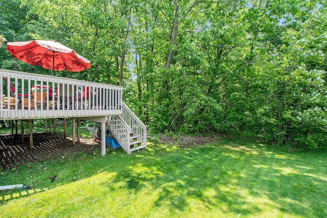 5591 E Grove Dr SE, Grand Rapids, MI 49512 - view of green lawn with stairs and a wooden deck