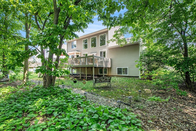 5591 E Grove Dr SE, Grand Rapids, MI 49512 - rear view of property featuring a wooden deck