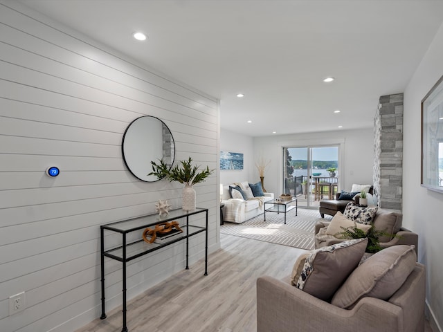 living area featuring recessed lighting and light wood-style flooring