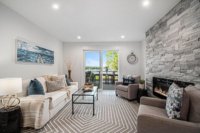 living room featuring a fireplace and recessed lighting