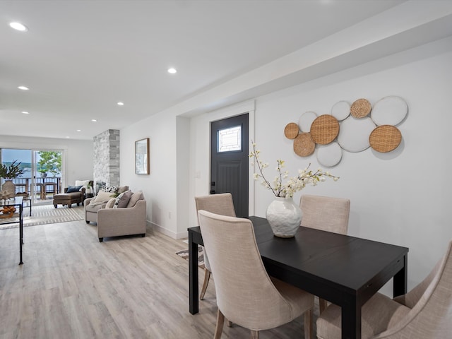 dining area with recessed lighting, baseboards, and light wood-style floors