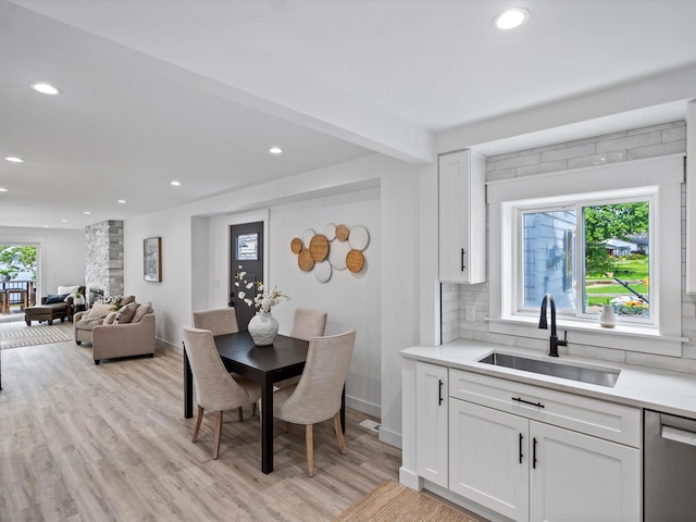 dining area featuring light wood-type flooring, recessed lighting, and baseboards