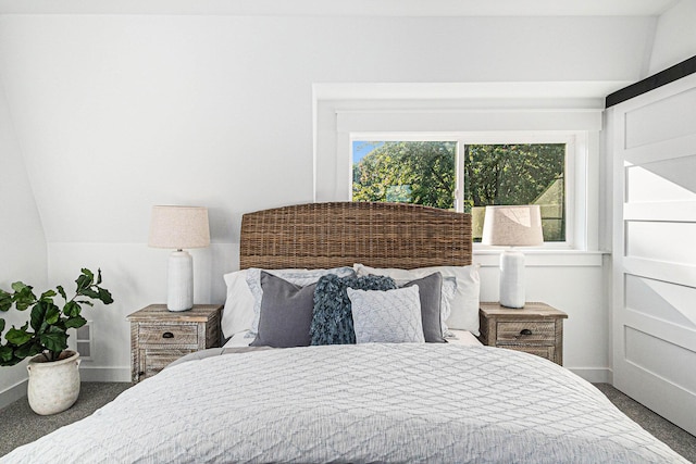 bedroom with baseboards, carpet flooring, and vaulted ceiling