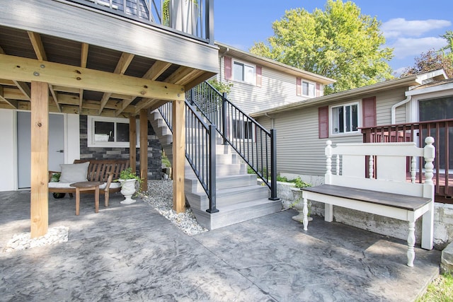 view of patio / terrace featuring stairs