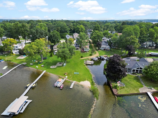 drone / aerial view with a water view and a residential view