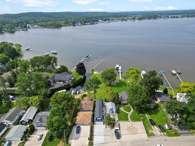 birds eye view of property with a residential view and a water view