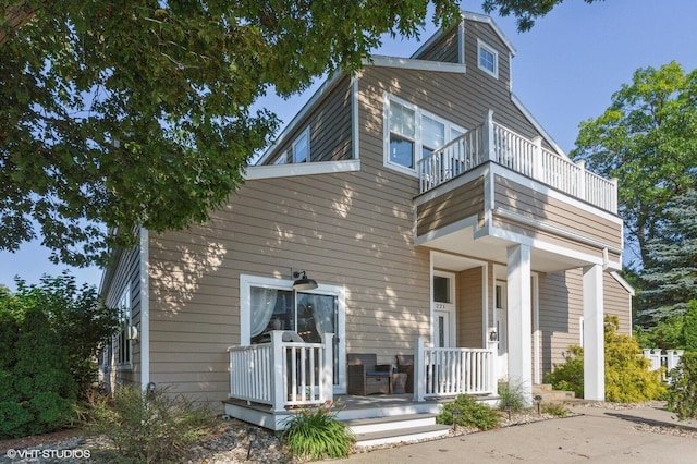 221 N Townsend St, New Buffalo, MI 49117 - back of house featuring a balcony and covered porch