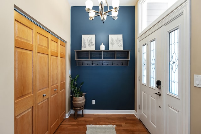 221 N Townsend St, New Buffalo, MI 49117 - entrance foyer with a chandelier, wood finished floors, and baseboards