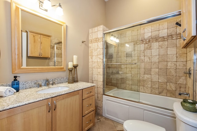 221 N Townsend St, New Buffalo, MI 49117 - full bathroom featuring toilet, vanity, combined bath / shower with glass door, and tile patterned floors