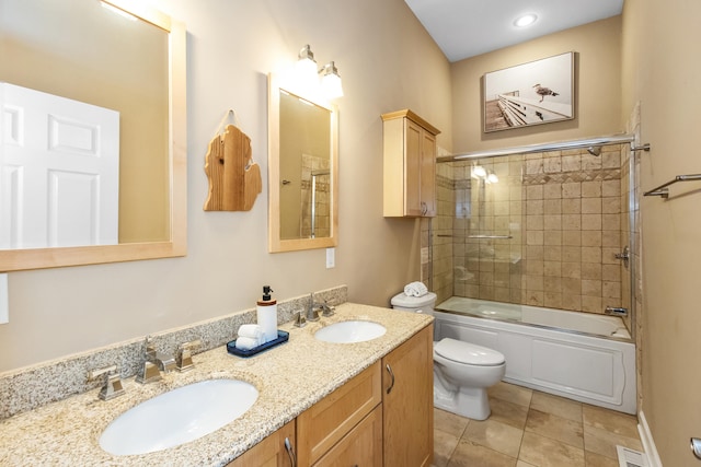 221 N Townsend St, New Buffalo, MI 49117 - full bath featuring toilet, double vanity, bath / shower combo with glass door, and tile patterned flooring