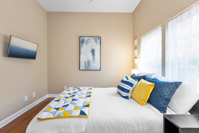 221 N Townsend St, New Buffalo, MI 49117 - bedroom featuring dark wood-style flooring and baseboards