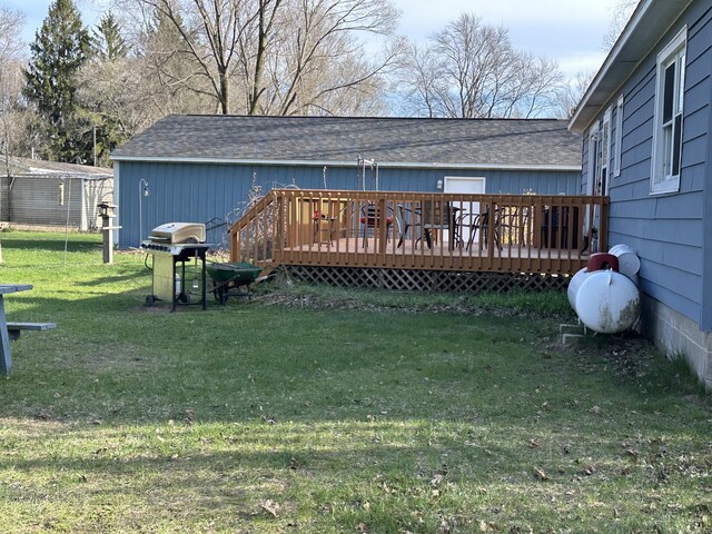 2080 N Mears St, Mears, MI 49436 - back of house featuring a yard, a deck, and a shingled roof