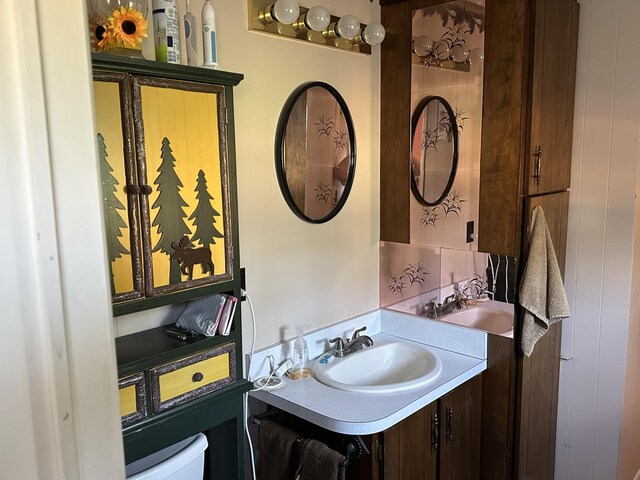 2080 N Mears St, Mears, MI 49436 - bathroom featuring toilet and vanity