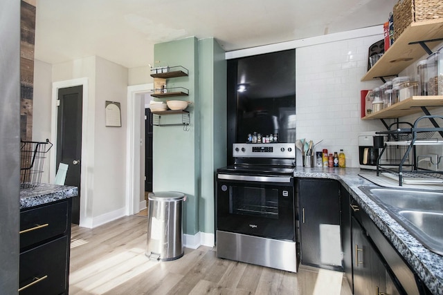 kitchen with open shelves, stainless steel electric stove, and dark cabinets