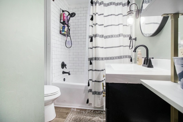 full bathroom featuring wood finished floors, vanity, toilet, and shower / bath combo