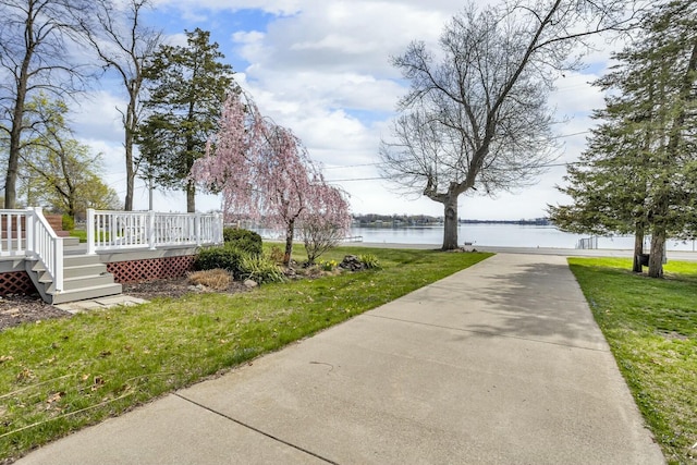 150 Hyde Rd, Clarklake, MI 49234 - surrounding community with a yard and a deck with water view