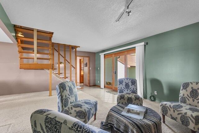 150 Hyde Rd, Clarklake, MI 49234 - living area with a textured ceiling, stairway, carpet floors, and track lighting