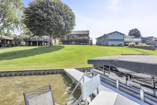 view of dock with a yard and boat lift