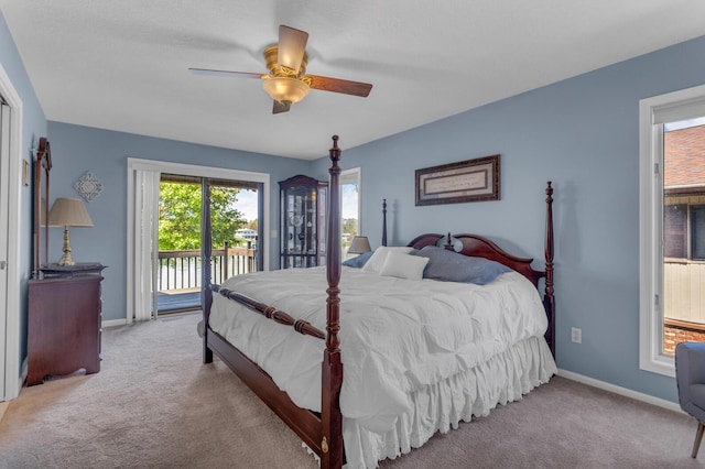 carpeted bedroom featuring access to outside, baseboards, and ceiling fan