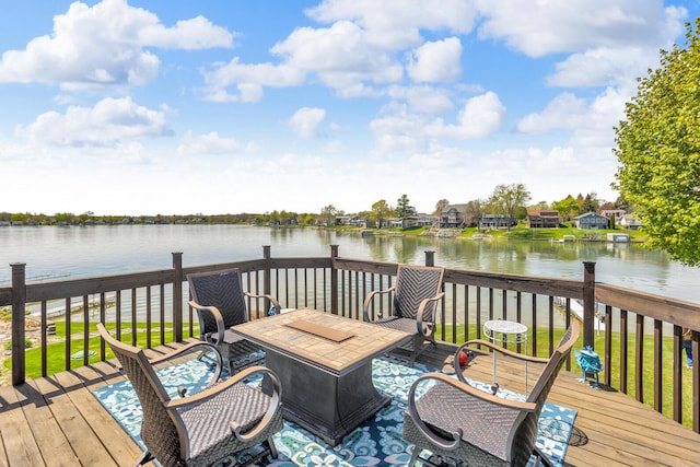 wooden deck featuring a water view