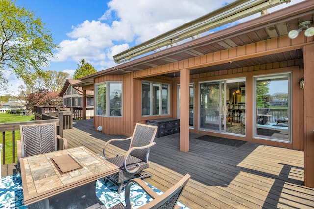 wooden deck with outdoor dining space
