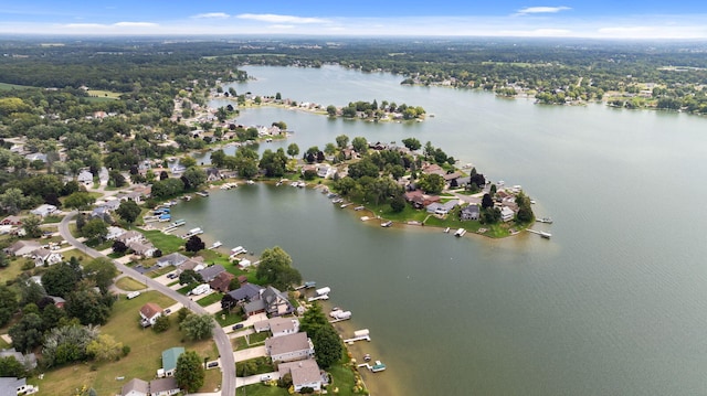 drone / aerial view featuring a residential view and a water view
