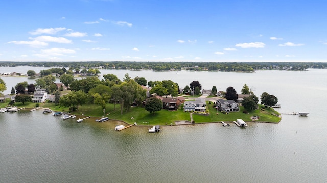 birds eye view of property featuring a water view and a residential view