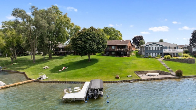 view of dock with a water view and a yard