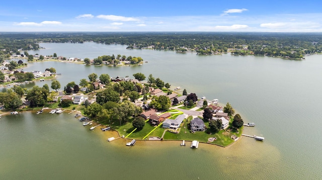 drone / aerial view featuring a residential view and a water view