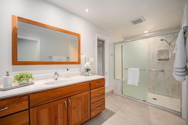 4040 Greenleaf Cir Unit 301, Kalamazoo, MI 49008 - bathroom with vanity, recessed lighting, visible vents, and a stall shower