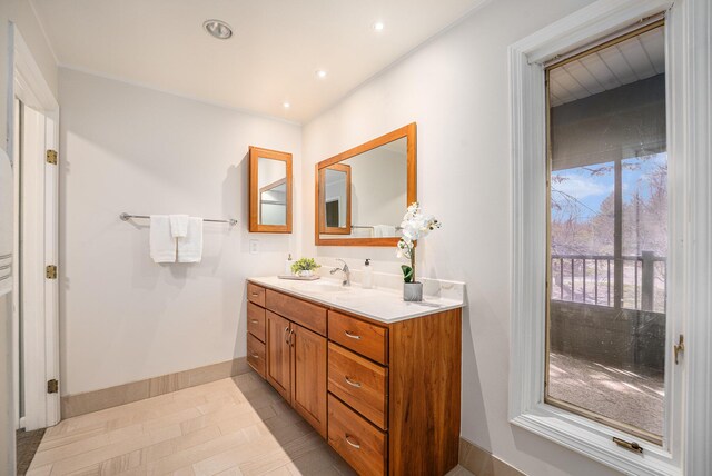 4040 Greenleaf Cir Unit 301, Kalamazoo, MI 49008 - bathroom featuring vanity, baseboards, and recessed lighting
