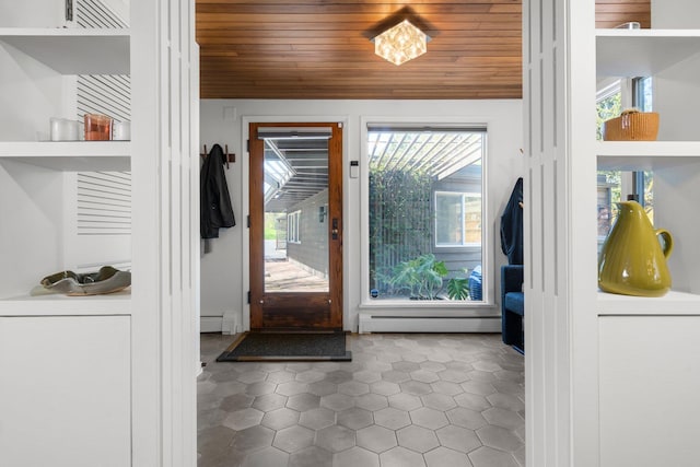 entryway with wooden ceiling, a baseboard radiator, a baseboard heating unit, and tile patterned floors