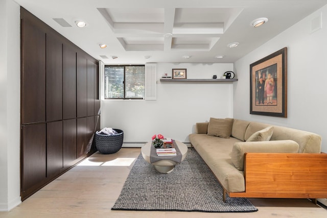 living area featuring baseboard heating, coffered ceiling, recessed lighting, and light wood-style flooring
