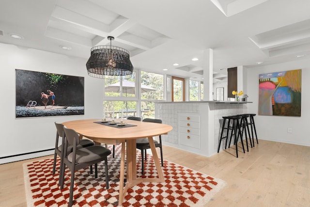 dining area featuring beam ceiling, a baseboard radiator, light wood-style floors, coffered ceiling, and recessed lighting
