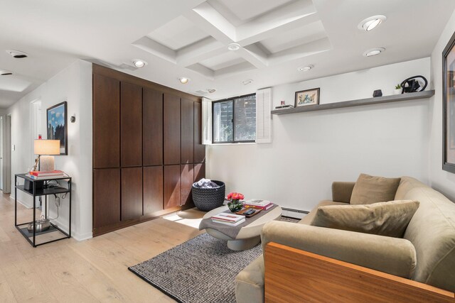 living area featuring baseboard heating, beamed ceiling, light wood-style floors, coffered ceiling, and recessed lighting
