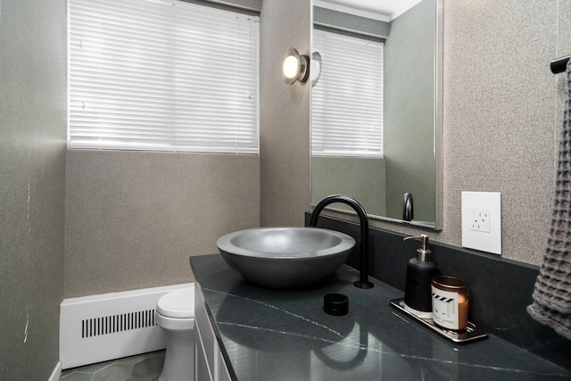 half bath with vanity and toilet
