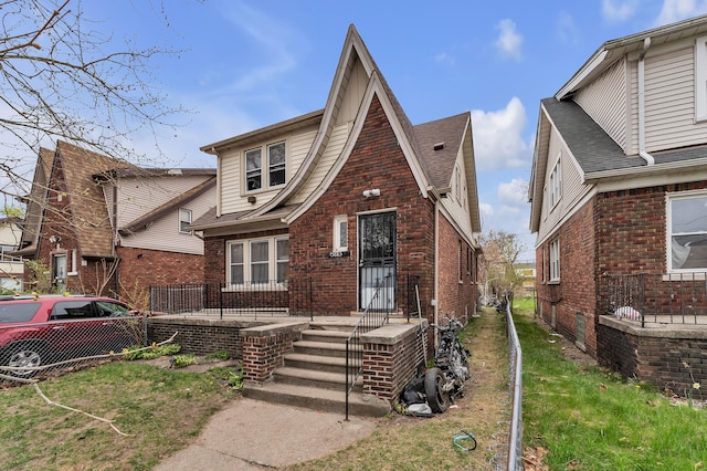 15885 Indiana St, Detroit, MI 48238 - tudor home with brick siding and fence