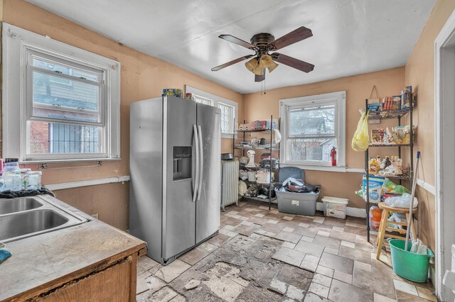 15885 Indiana St, Detroit, MI 48238 - kitchen featuring a sink, stainless steel fridge with ice dispenser, radiator, a ceiling fan, and stone tile flooring