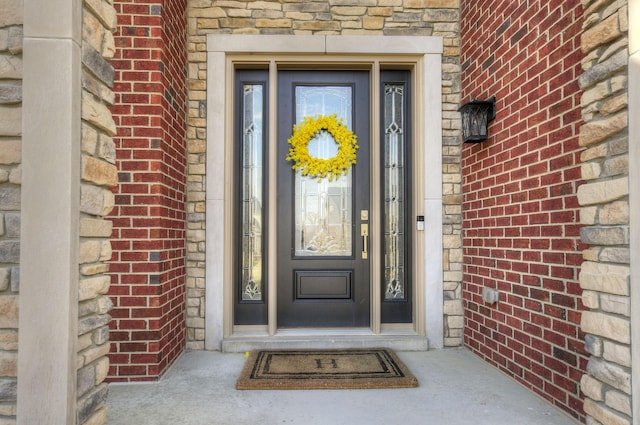51583 Turnburry Dr, South Lyon, MI 48178 - view of exterior entry featuring brick siding and stone siding