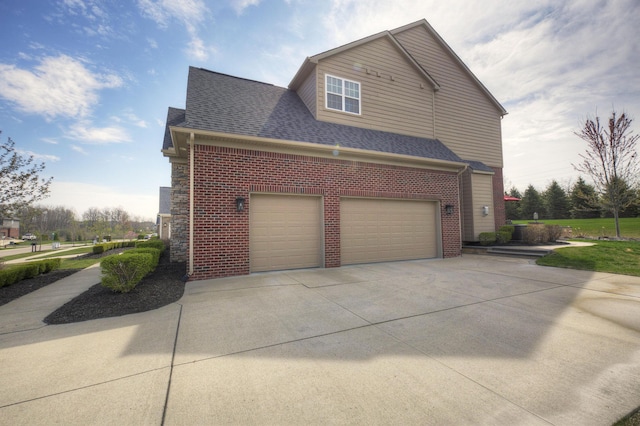 51583 Turnburry Dr, South Lyon, MI 48178 - view of home's exterior featuring roof with shingles, concrete driveway, and brick siding