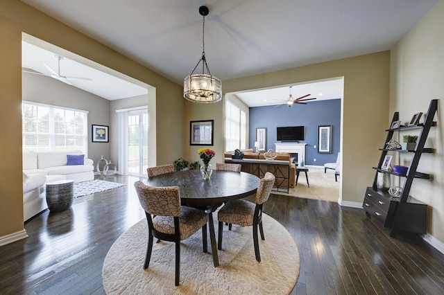 51583 Turnburry Dr, South Lyon, MI 48178 - dining area featuring dark wood-type flooring, ceiling fan, and a healthy amount of sunlight