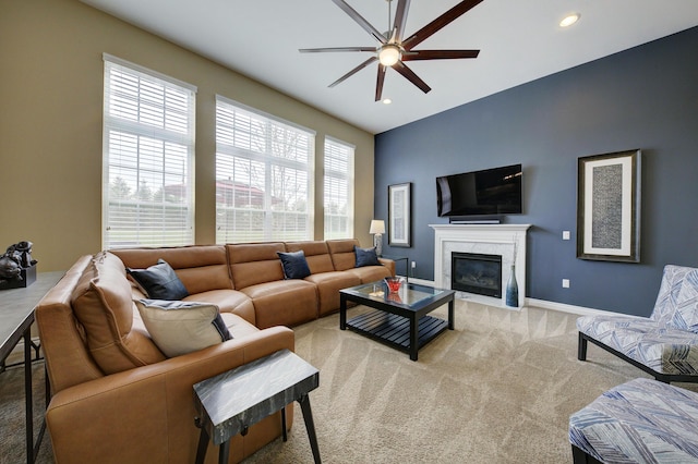 51583 Turnburry Dr, South Lyon, MI 48178 - living room with a ceiling fan, a high end fireplace, baseboards, light carpet, and recessed lighting