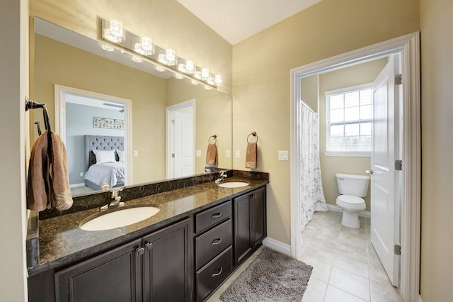 51583 Turnburry Dr, South Lyon, MI 48178 - ensuite bathroom featuring a sink, ensuite bath, toilet, and double vanity