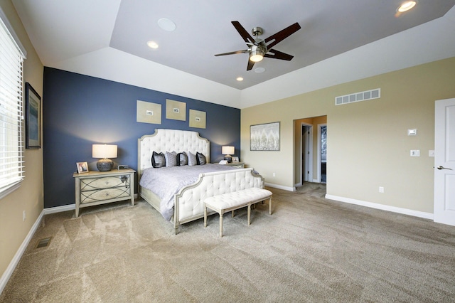 51583 Turnburry Dr, South Lyon, MI 48178 - bedroom featuring visible vents, baseboards, carpet floors, and vaulted ceiling
