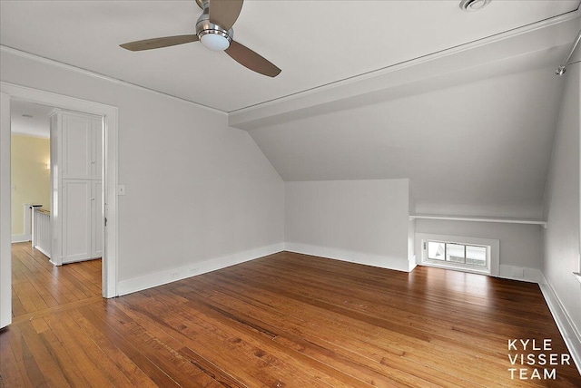 bonus room featuring baseboards, a ceiling fan, hardwood / wood-style flooring, and lofted ceiling