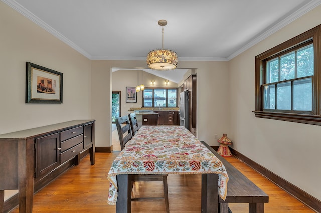 1115 Henry St, Ann Arbor, MI 48104 - dining room with ornamental molding and light wood-style floors
