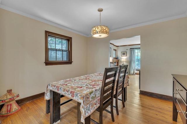 1115 Henry St, Ann Arbor, MI 48104 - dining space with plenty of natural light, crown molding, and light wood finished floors