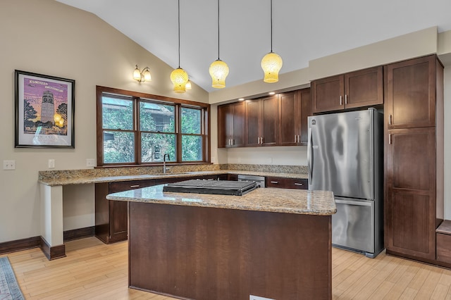 1115 Henry St, Ann Arbor, MI 48104 - kitchen featuring freestanding refrigerator, black cooktop, lofted ceiling, light wood-style floors, and dark brown cabinetry