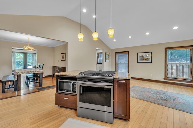 1115 Henry St, Ann Arbor, MI 48104 - kitchen with appliances with stainless steel finishes, light wood-style floors, light stone countertops, recessed lighting, and high vaulted ceiling